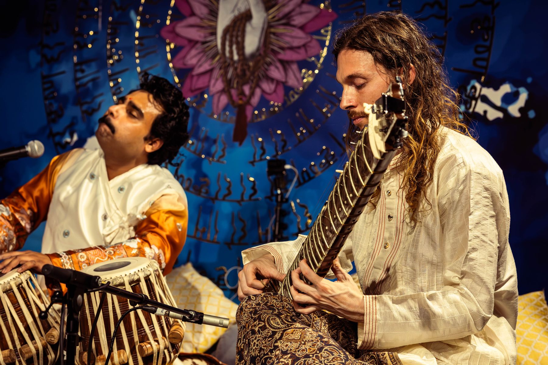 Talayan performing live — tabla and sitar on stage together