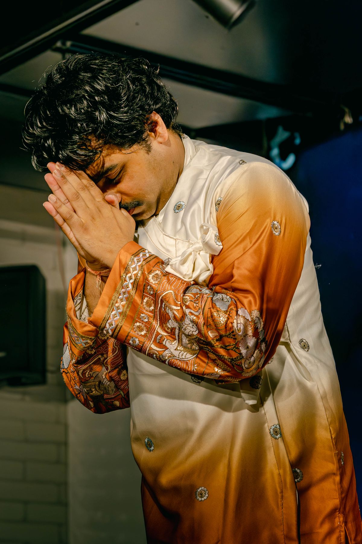 Manmohan Dogra in a moment of prayer before performing