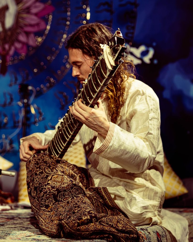 Etienne Bartholomew playing the sitar